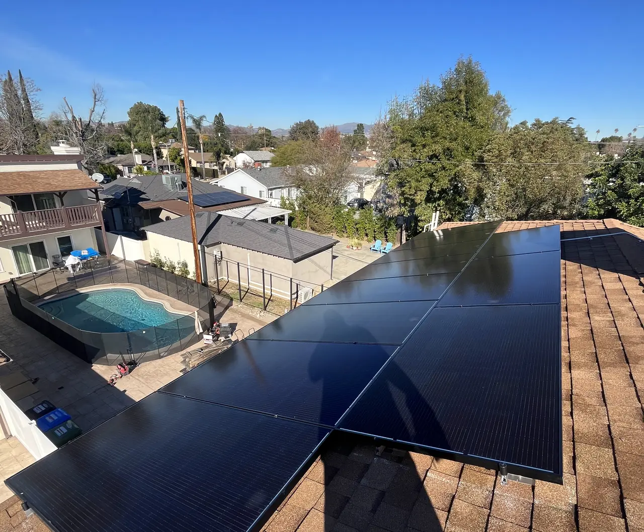Two meters on one wall, and two houses behind them