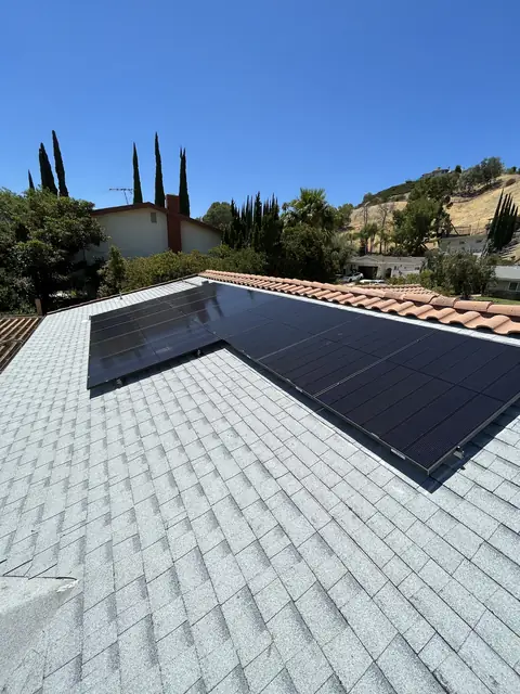Solar panel mounting detail on a composition shingle roof in West Hills, CA
