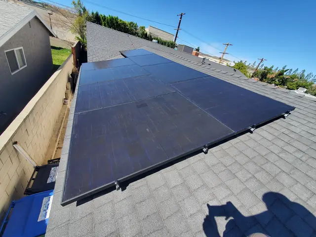 Solar panel mounting detail on a composition shingle roof in West Hills, CA