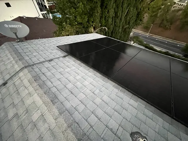 Solar panel mounting detail on a composition shingle roof in West Hills, CA