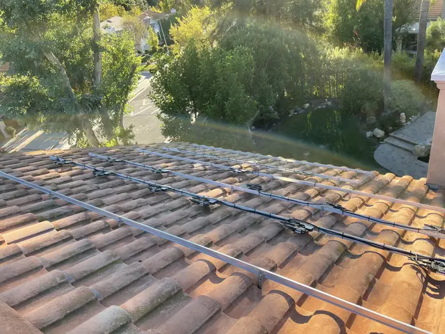 Solar panel mounting detail on a tile roof in West Hills, CA