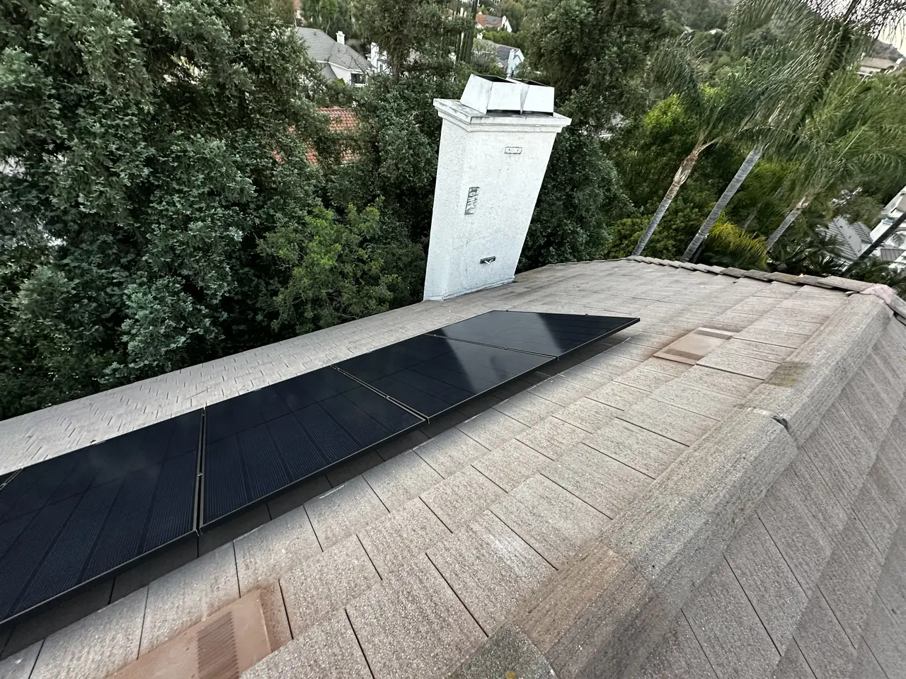 Multi-plane solar array on a concrete tile roof in West Hills
