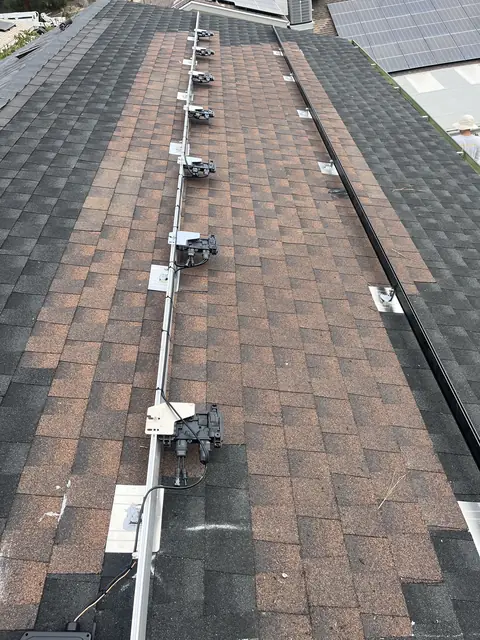 Solar panel mounting detail on a composition shingle roof in West Hills, CA