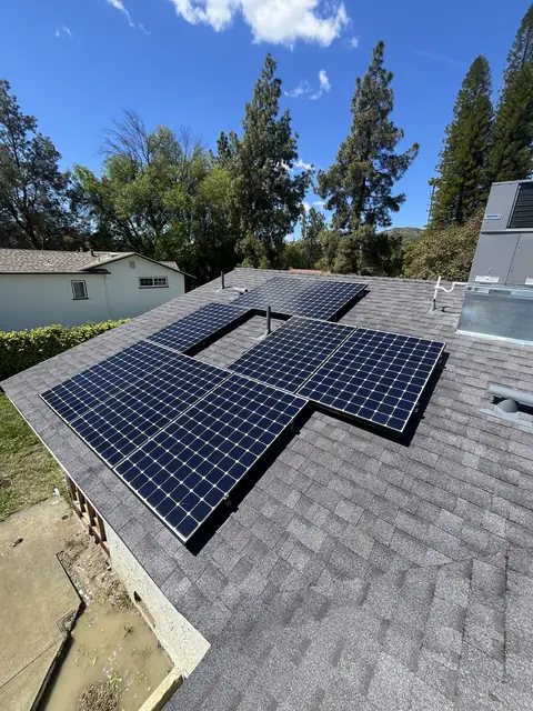 Solar panel mounting detail on a composition shingle roof in West Hills, CA