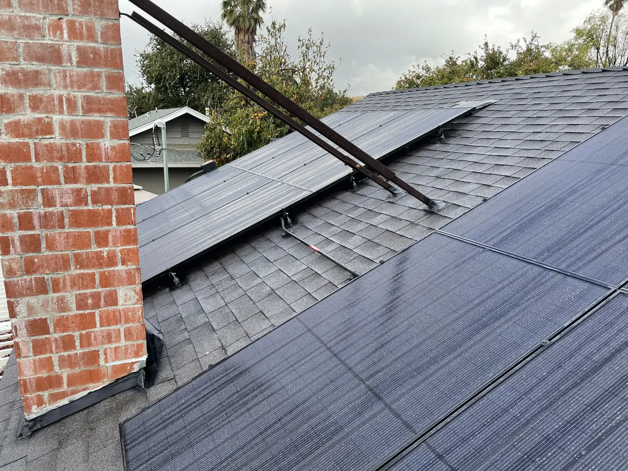 Solar panel mounting detail on a composition shingle roof in West Hills, CA