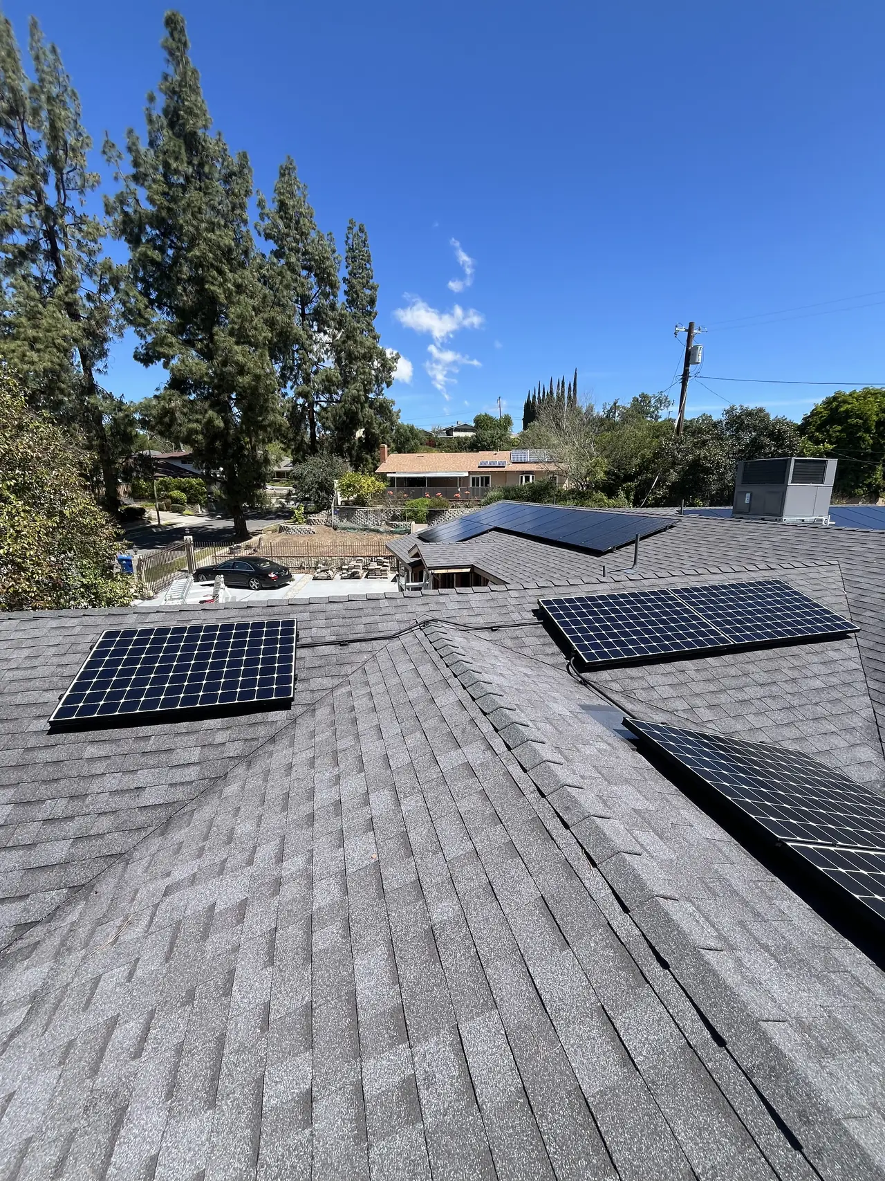 Solar array seen along the ridge with the neighbourhood behind, West Hills