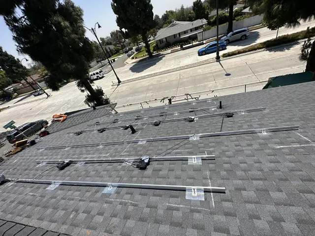 Solar panel mounting detail on a composition shingle roof in Whittier, CA