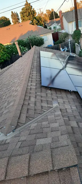 Solar panel mounting detail on a composition shingle roof in Whittier, CA
