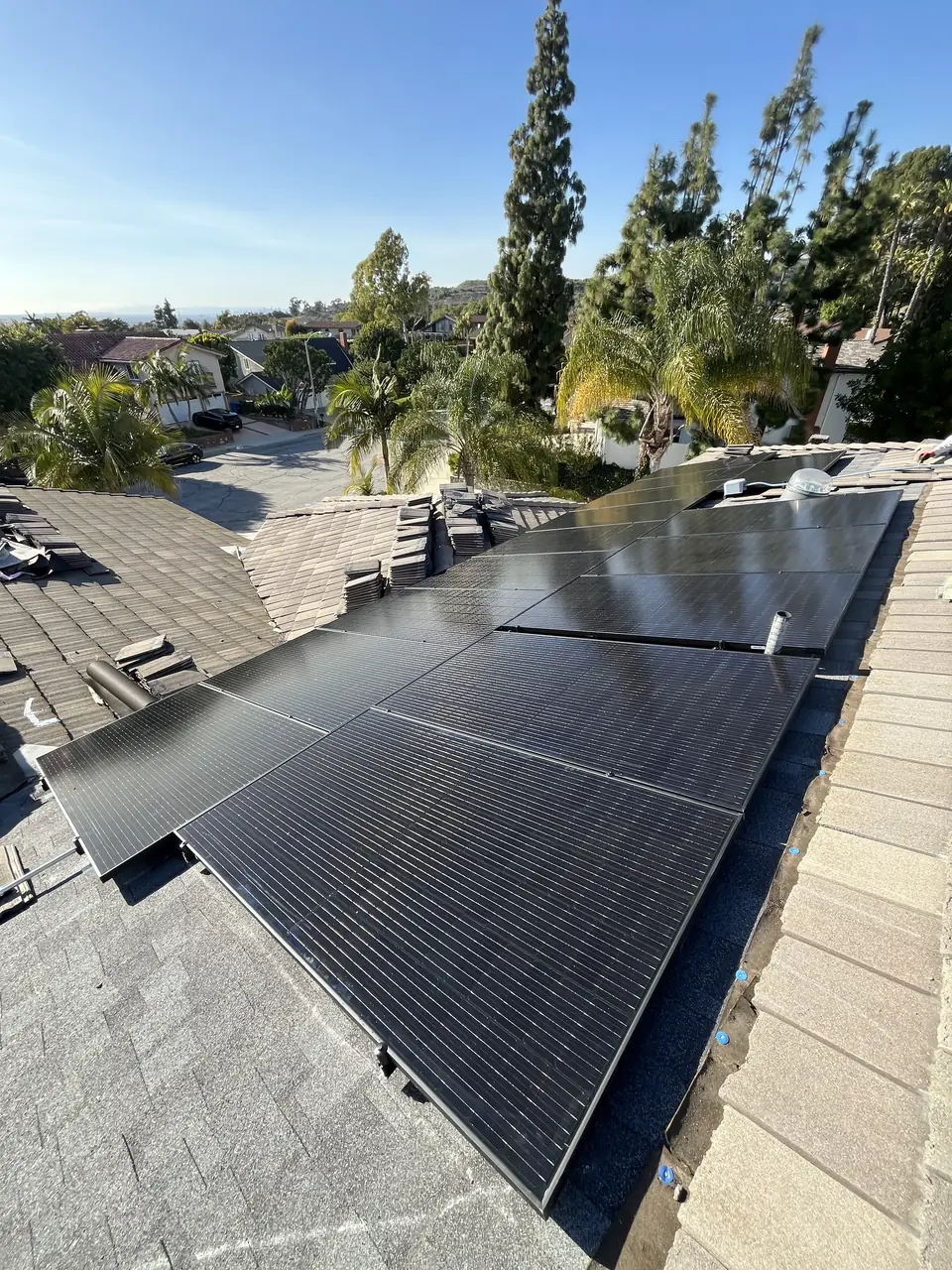 Solar panel mounting detail on a tile roof in Whittier, CA