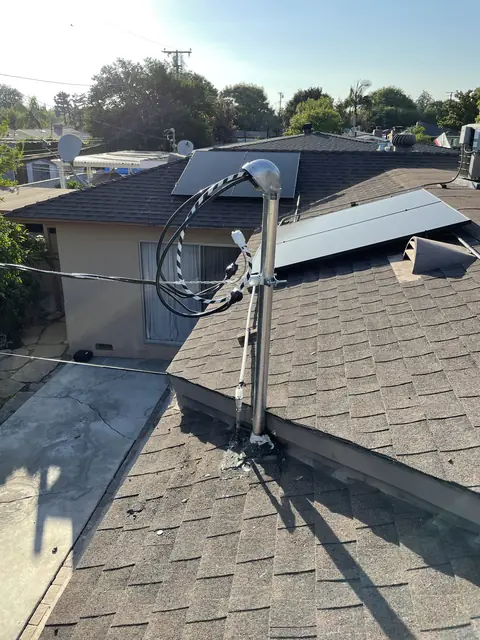 Solar panel mounting detail on a composition shingle roof in Whittier, CA