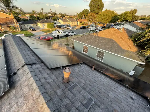 Solar panel mounting detail on a composition shingle roof in Whittier, CA