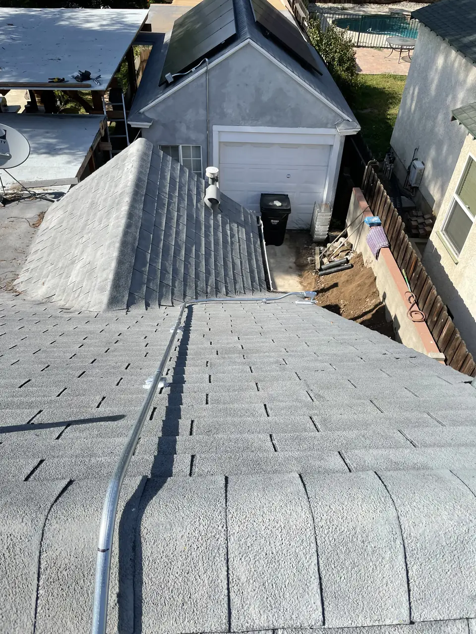 Solar panel mounting detail on a composition shingle roof in Whittier, CA