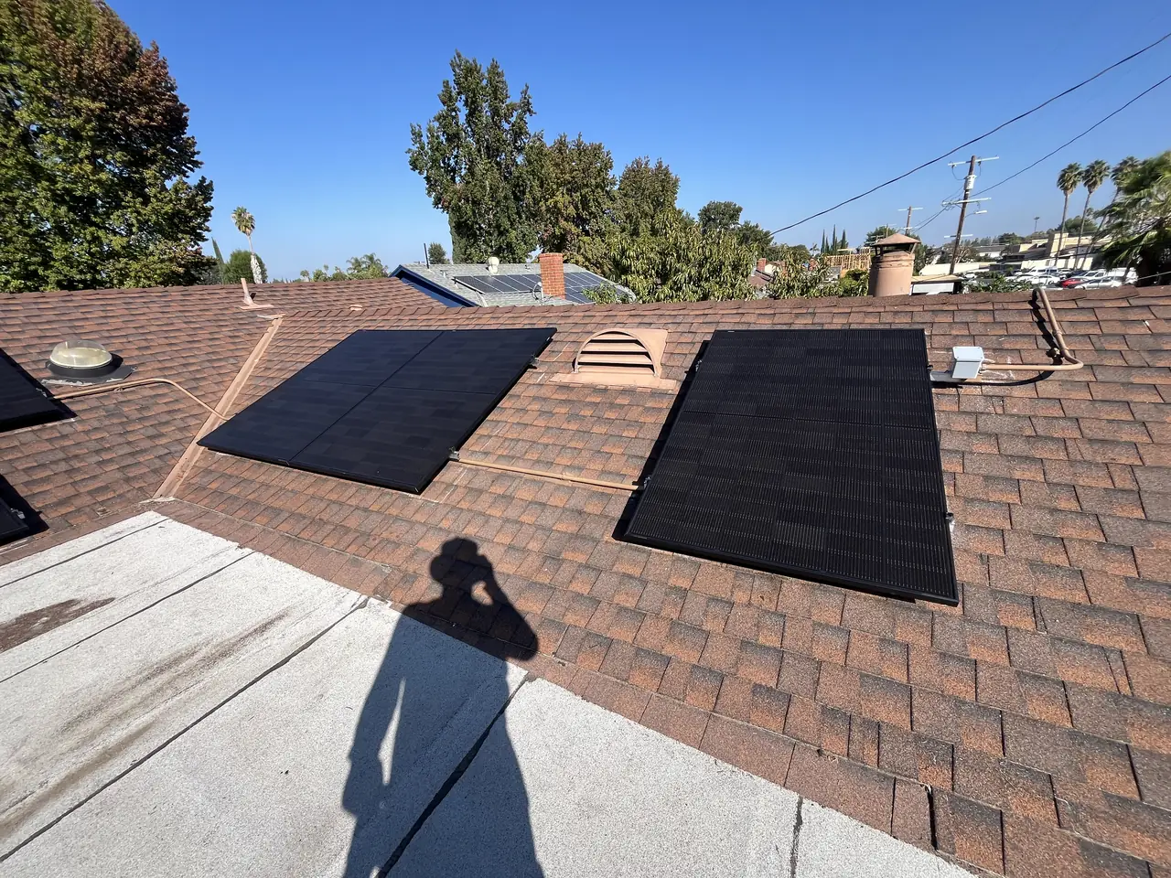 Solar array on a shingle roof seen from the ridge, Winnetka