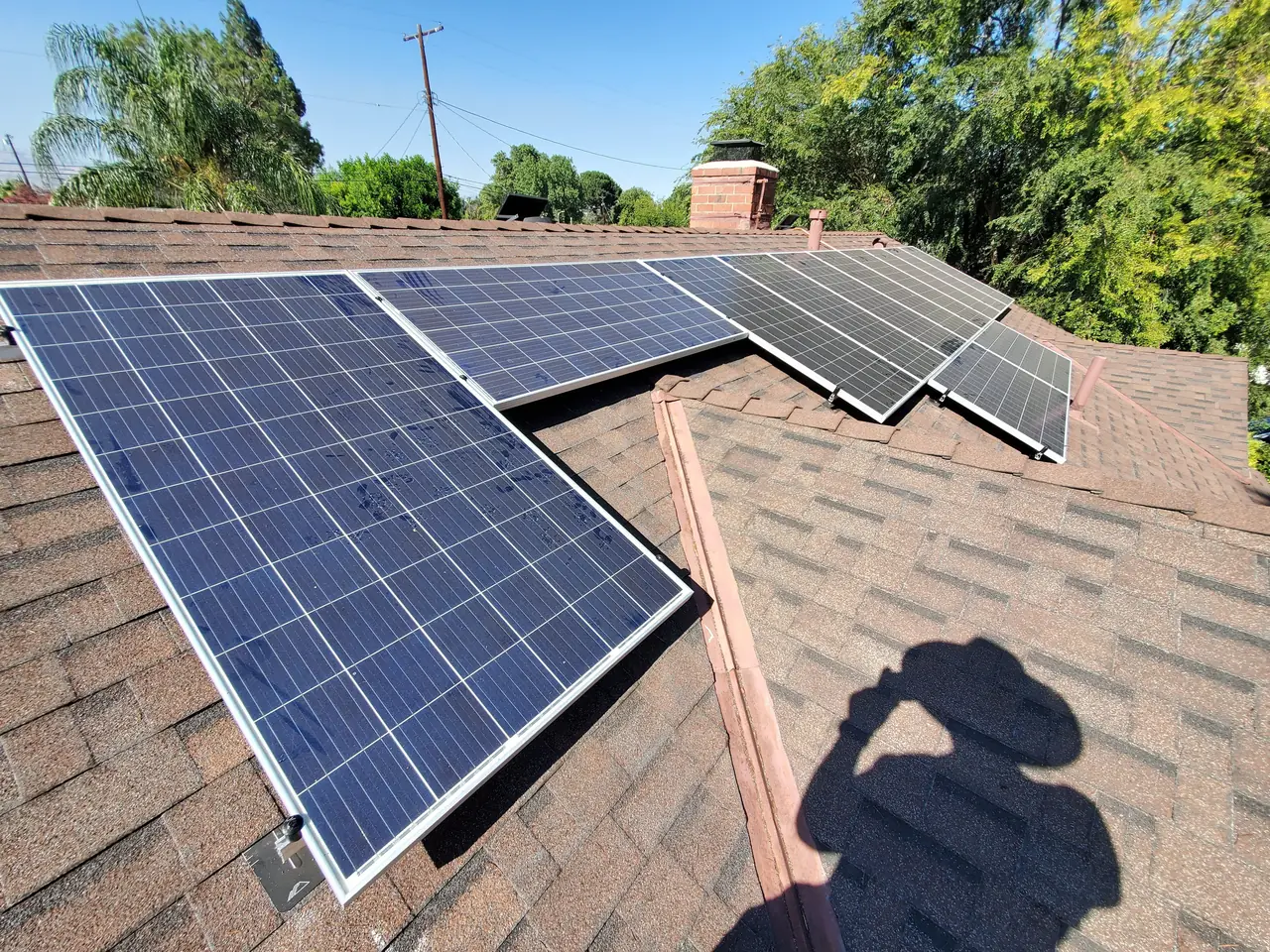 Solar modules seen from the ridge with the neighbourhood behind, Winnetka