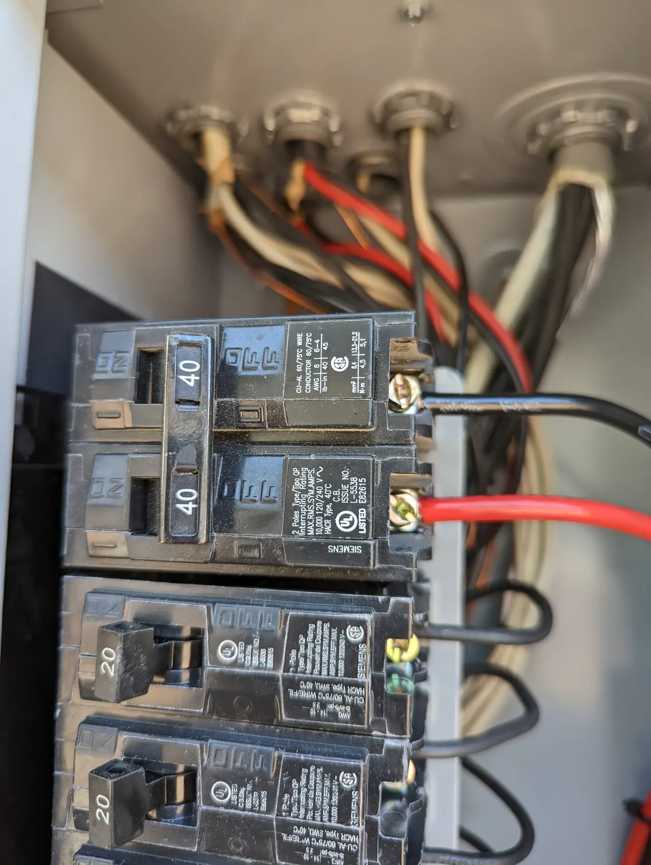 New main service panel with feeders entering through the wall, Winnetka