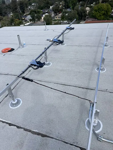 Solar panel mounting detail on a rooftop in Woodland Hills, CA
